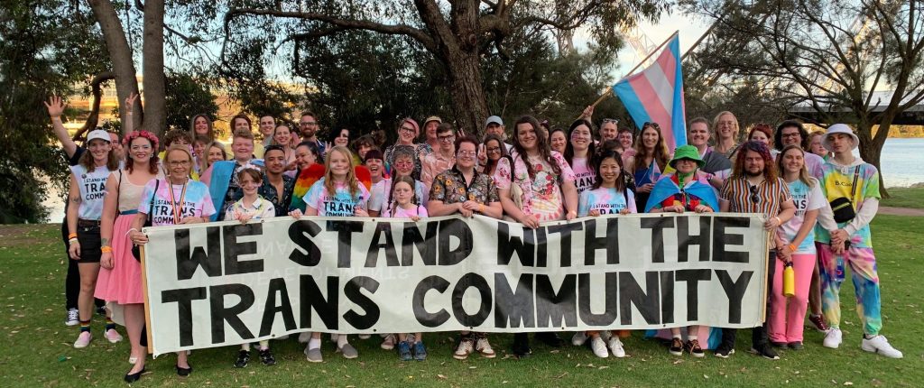 large group of people celebrating transgender